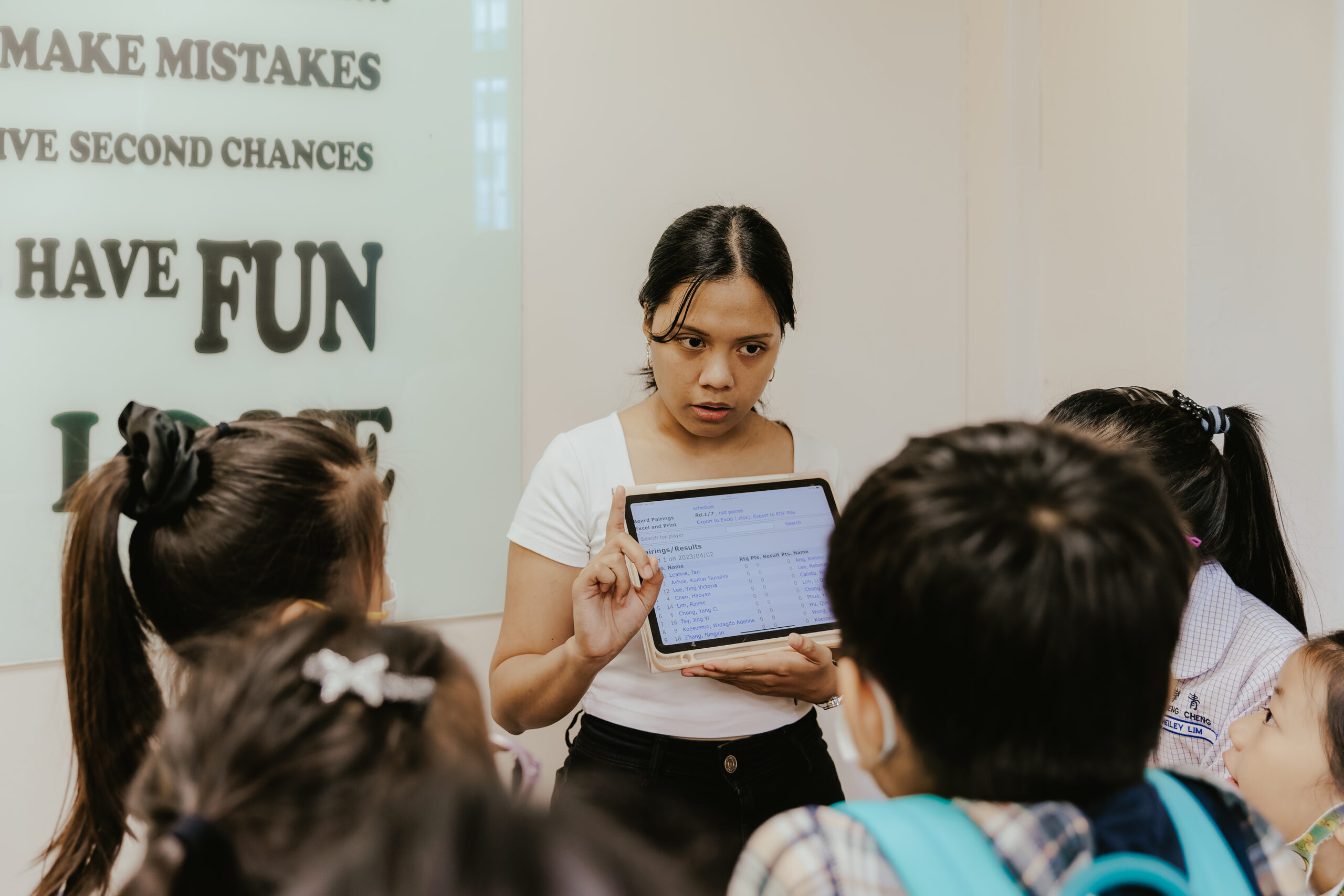 Chess Grande coach guiding students during a lesson